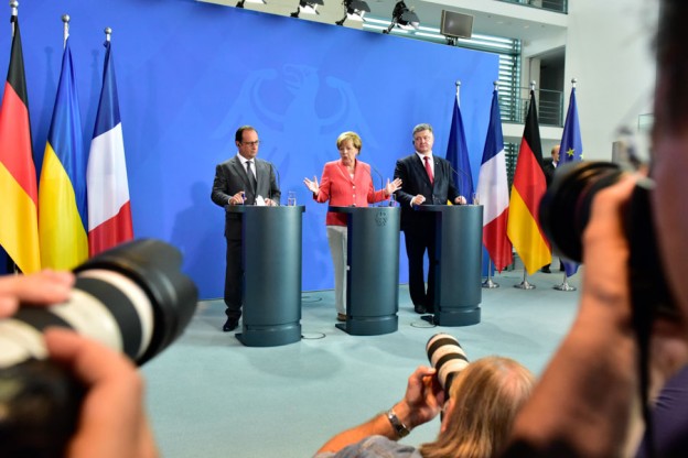 The Big Picture: Francois Hollande, Angela Merkel, Petro Poroshenko. And some colleagues' lenses.