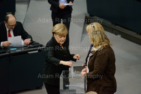 Angela Merkel puts her ballot in the box in the vote for Chancellor in the Bundestag