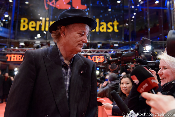 Bill Murray chats with a TV crew on the red carpet at the premiere of Monuments Men. Changing his hat every time and always having fun, Murray was certainly a media favorite this time around.