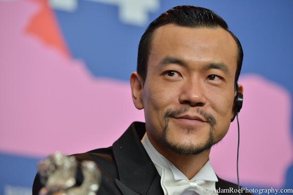 Lio Fan wins the best dressed award as well as best actor for his work in Black Coal Thin Ice, which also took home the Golden Bear for best film. Fan cracks a smile during the winner's press conference. His silver bear pokes into the frame at the left.