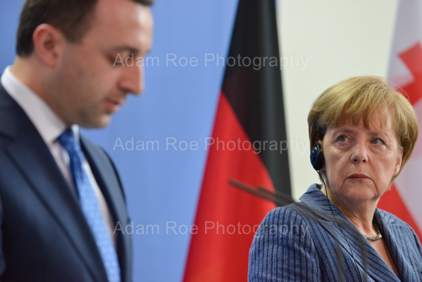 Merkel listens carefully and looks sceptical as Garibashvili speaks.