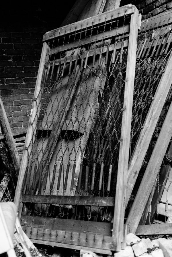 A stack of old wooden beds, presumably from the days when up to 1400 homeless people could spend the night there.