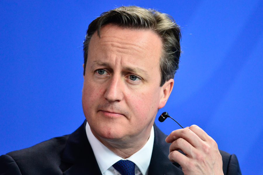 David Cameron having a slight earpiece malfunction.