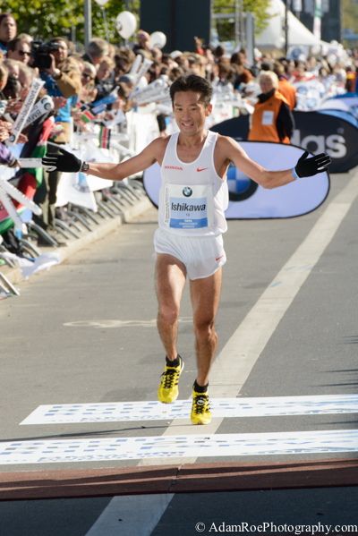 Suehiro Ishikaw crossing the finish line at the Berlin Marathon