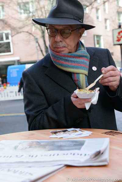 Berlinale's director Dieter Kosslick takes a pause to read the news at the food carts, a gourmet addition to the scene - but still less pricey than the junk in Potsdamer Platz.