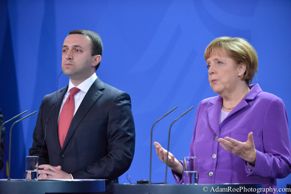 Angela Merkel speaks while Irakli Garibashvili, the Prime Minister of Georgia, listens.