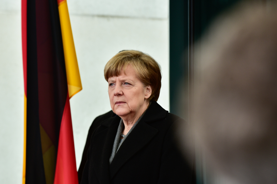 Angela Merkel waits for Francois Hollande at the Federal Chancellery in Berlin.