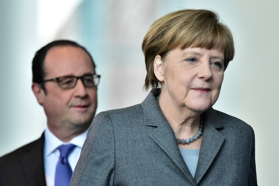 The happy duo of Merkel and Hollande stroll to their press conference together.